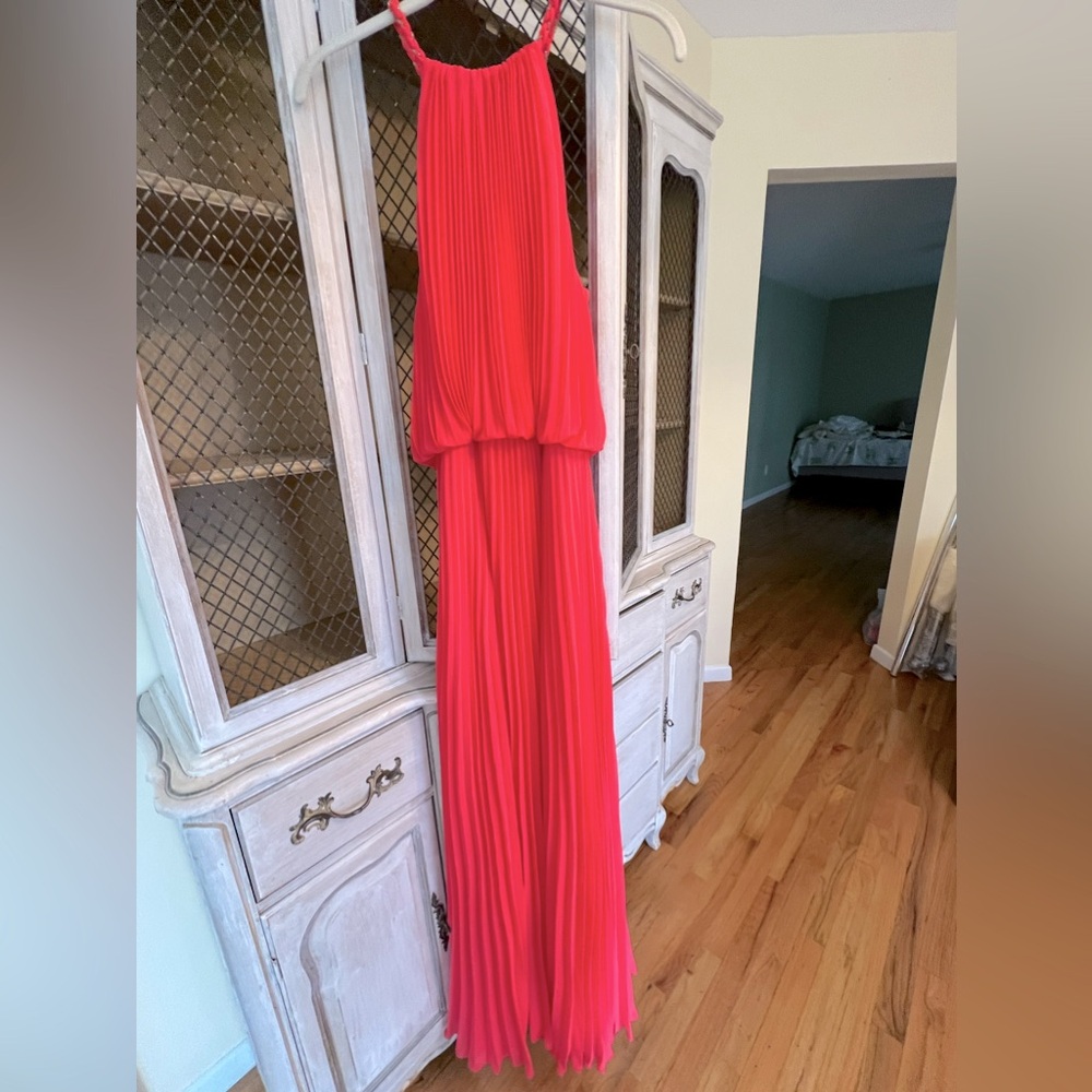 Coral gown, on the body great. Looks fab on! From Bloomingdales. Fits 10-12 size